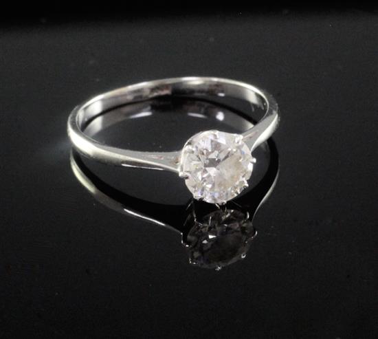 An 18ct white gold and solitaire diamond ring, size O.